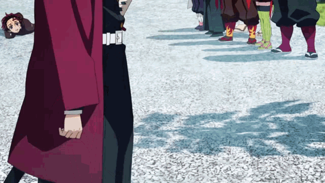a man in a red coat is standing next to another man in a black suit