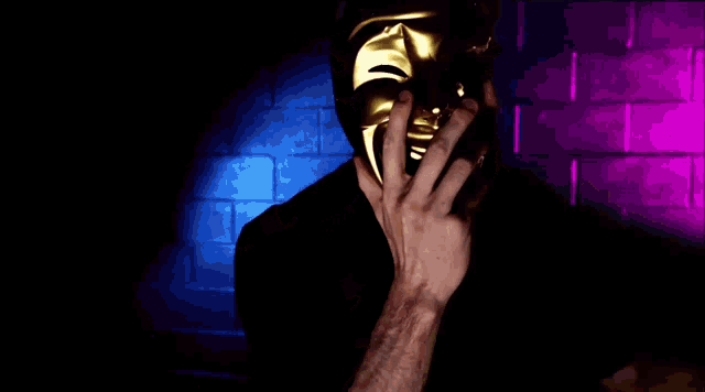 a man with a beard is screaming in front of a blue and purple background