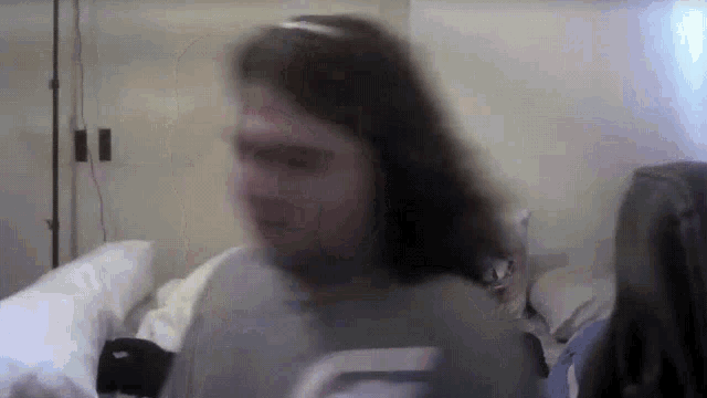 a blurry picture of a girl with a headband on