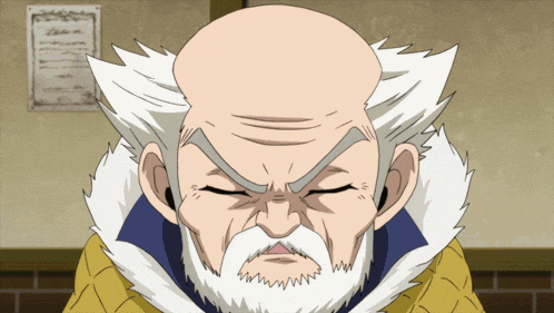 a bald man with a beard is looking at the camera