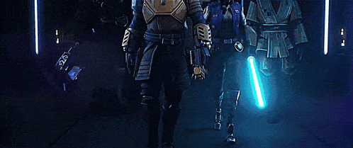 a group of star wars characters are standing next to each other in a room .