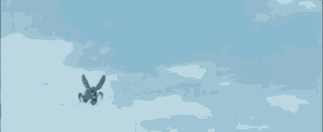 a close up of a monster with wings flying in the air .