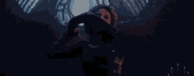 a woman is holding a sword in a dark room in a movie .