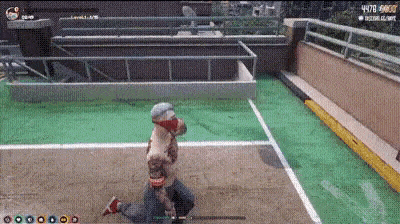 a person is kneeling on the ground in a video game while playing a game .