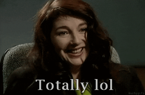 a woman with red hair is smiling with the words totally lol behind her