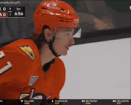 a hockey player wearing a red helmet with navigator on it