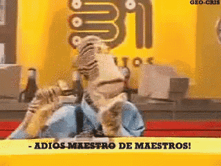 a cartoon character is standing in front of a sign that says adios-maestro de maestros