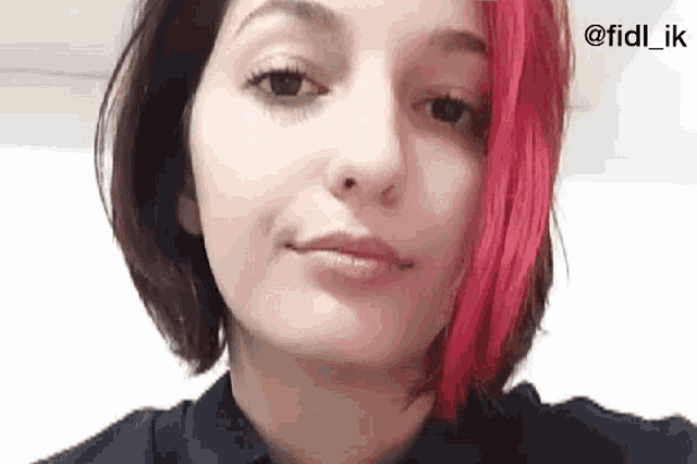 a woman with red hair is making a funny face