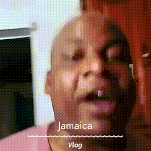 a close up of a man 's face with the words jamaica vlog on the bottom
