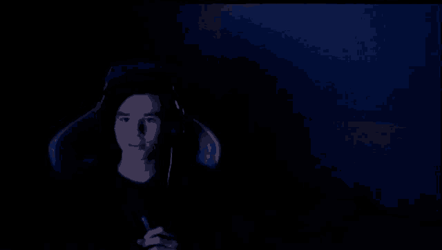 a dark blue background with a few white dots on it