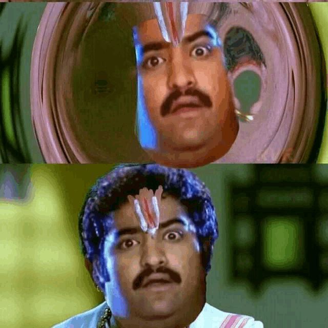 a man with a mustache and a reflection of himself in a glass