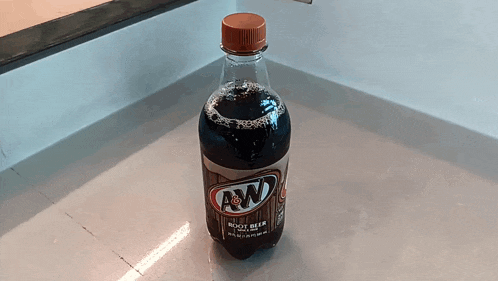 a bottle of a&w root beer is on a counter
