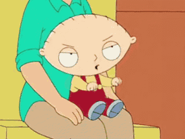 a cartoon character sitting on a man 's lap