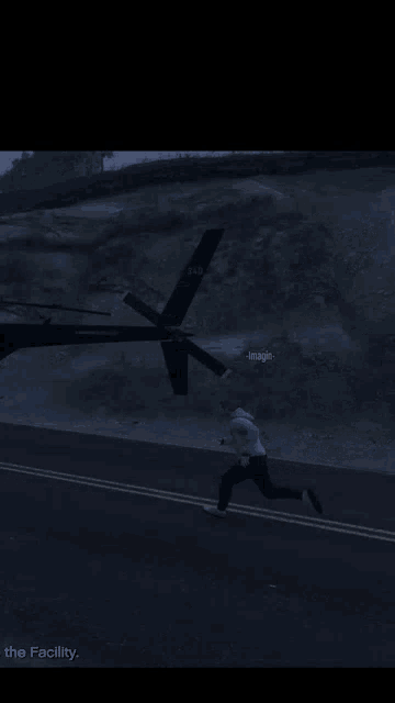 a helicopter is flying over a road with the facility written on the bottom right