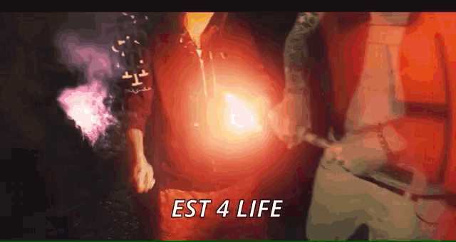 a person holding a torch with the words " est 4 life " on the bottom right