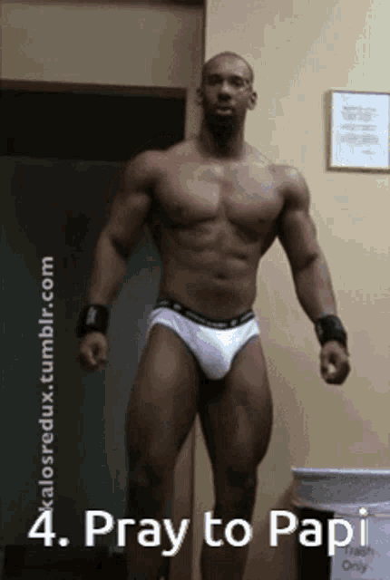 a man in white under armour underwear stands in front of a trash can