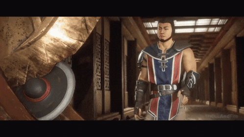 a man with a beard is standing in a hallway next to a sword