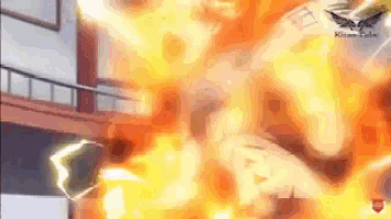 a person is standing in a room with a lot of flames coming out of it .