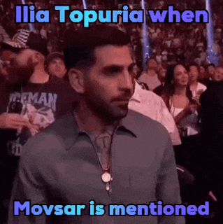 a man in a crowd watching a boxing match with a caption that says ilia topuria when movsar is mentioned