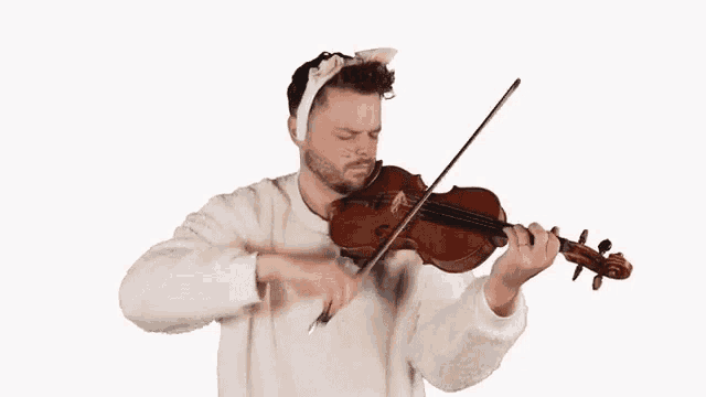 a man wearing a cat costume is playing a violin