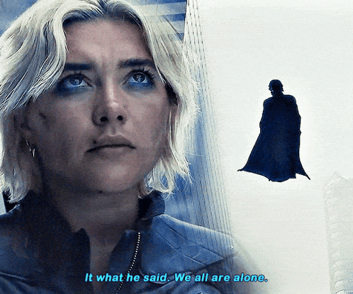 a woman says " it what he said we all are alone " next to a man in a cape