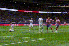 a group of soccer players are playing a game on a field