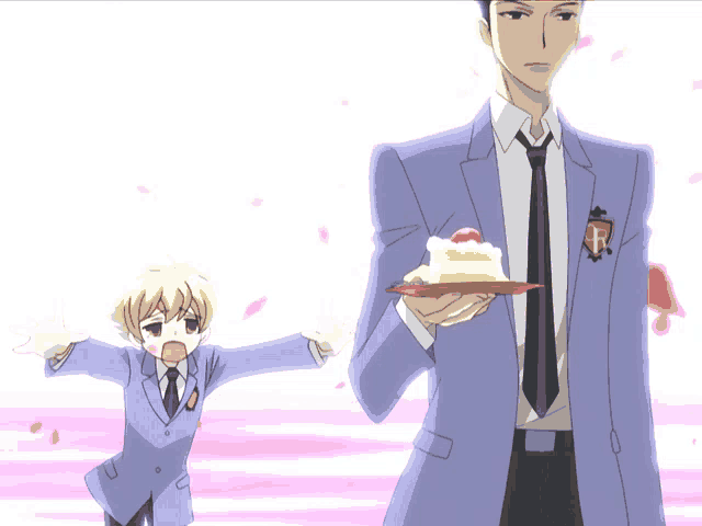 a man in a suit and tie is holding a cake