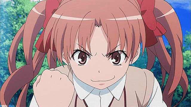 a girl with pigtails is making a funny face
