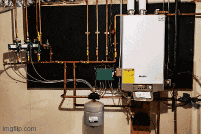 a boiler with a yellow sticker on it that says ' warning '