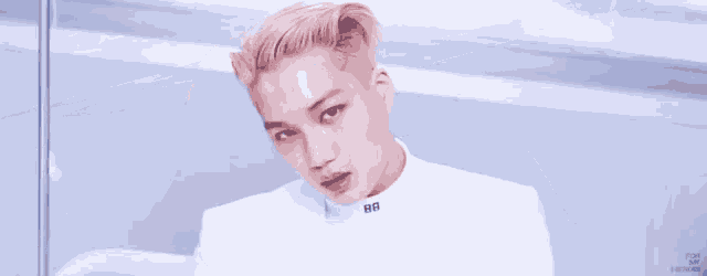a close up of a person 's face with a blue box in the background that says ' pop up ' on it