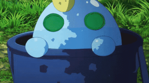 a blue object with green circles on it sits in a blue bucket