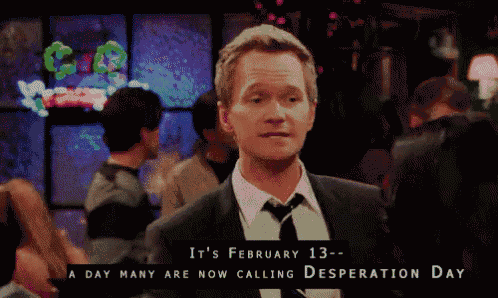 a man in a suit and tie is standing in front of a sign that says it 's february 13
