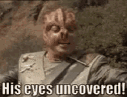 a man with a skull on his face is holding a gun and says `` his eyes uncovered '' .