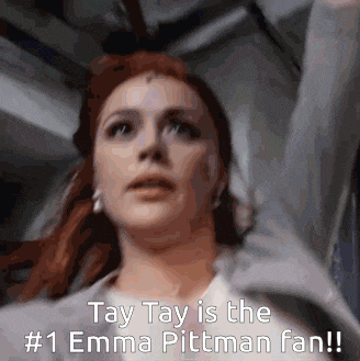 a close up of a woman 's face with the caption tay tay is the # 1 emma pittman fan