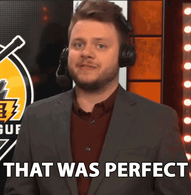 a man in a suit and headphones says " that was perfect "