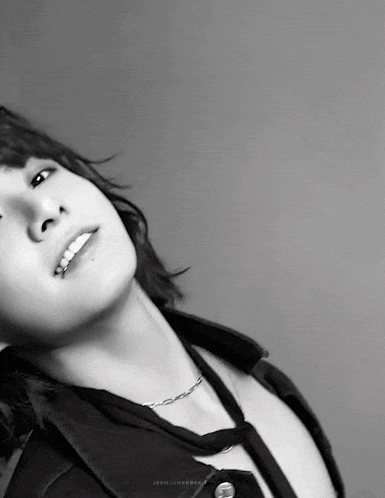 a black and white photo of a person with the word jeon written on the bottom