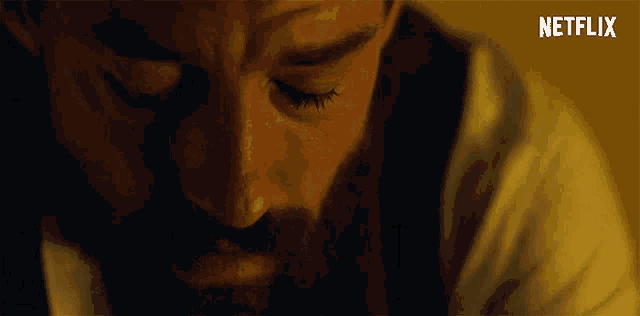 a close up of a man 's face with the word netflix on the bottom