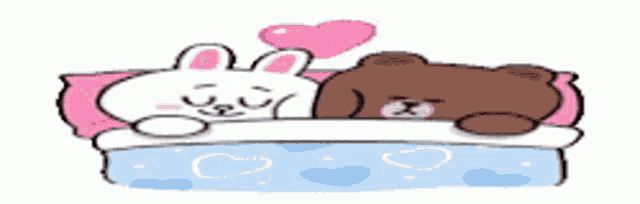 a brown bear and a white rabbit are laying on a bed with hearts on it .