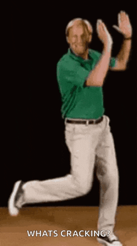 a man in a green shirt and white pants is dancing and says what 's cracking ?