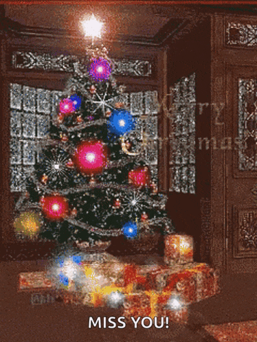 a christmas tree in a living room with the words " miss you " on the bottom
