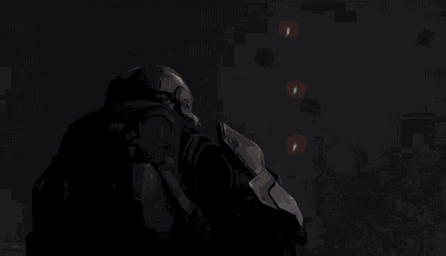 a man in a helmet is standing in a dark room with a bunch of fireworks flying in the background .