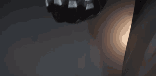a close up of a person 's hand with a chain around it