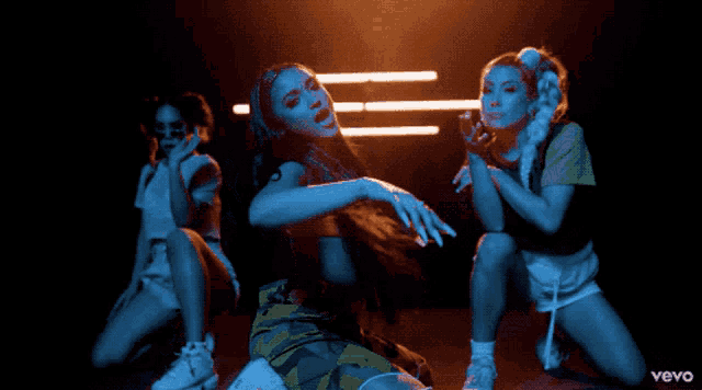 a group of women are dancing in a video that says vevo