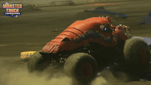 a monster truck is driving on a dirt track with the words monster truck throwdown written on the bottom