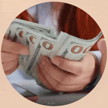 a person holding a stack of 100 dollar bills in their hands