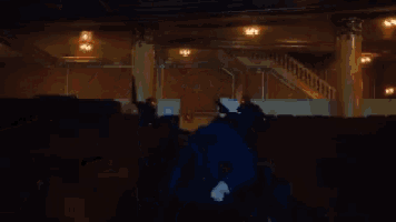 a dark auditorium with stairs leading up to the top