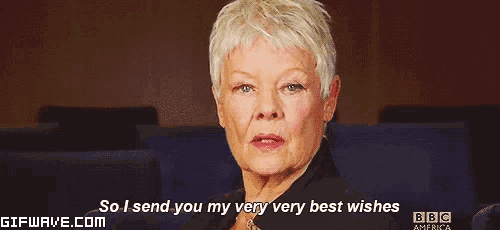 an older woman is sitting in a dark room and saying `` so i send you my very very best wishes ''