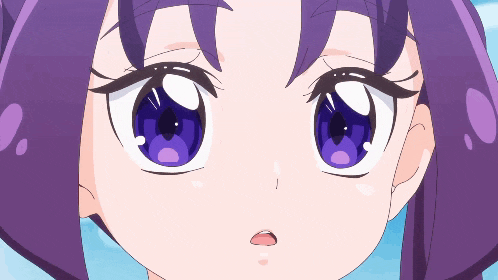 a close up of a girl 's face with purple hair
