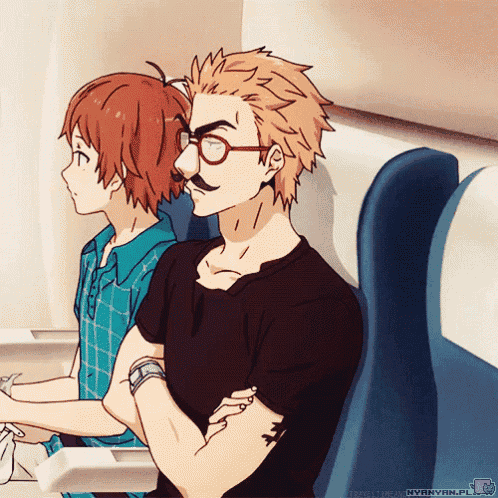 a man with glasses and a mustache is sitting next to a girl
