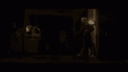 a blurry picture of a person in a dark room with the words c ' est la fête !